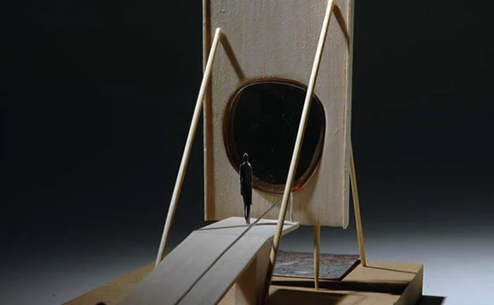 Sketch model of a ramp leading to a panel with an oval opening