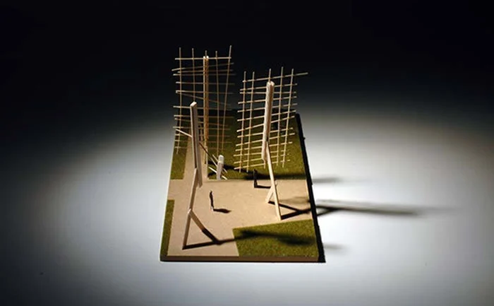 Sketch model of two timber grids on angled posts over a small square