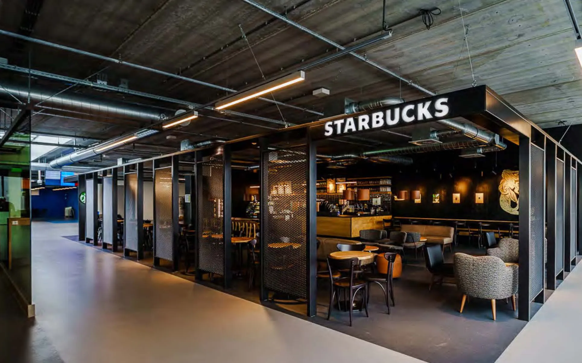 Airside store framed by a black steel perimeter structure