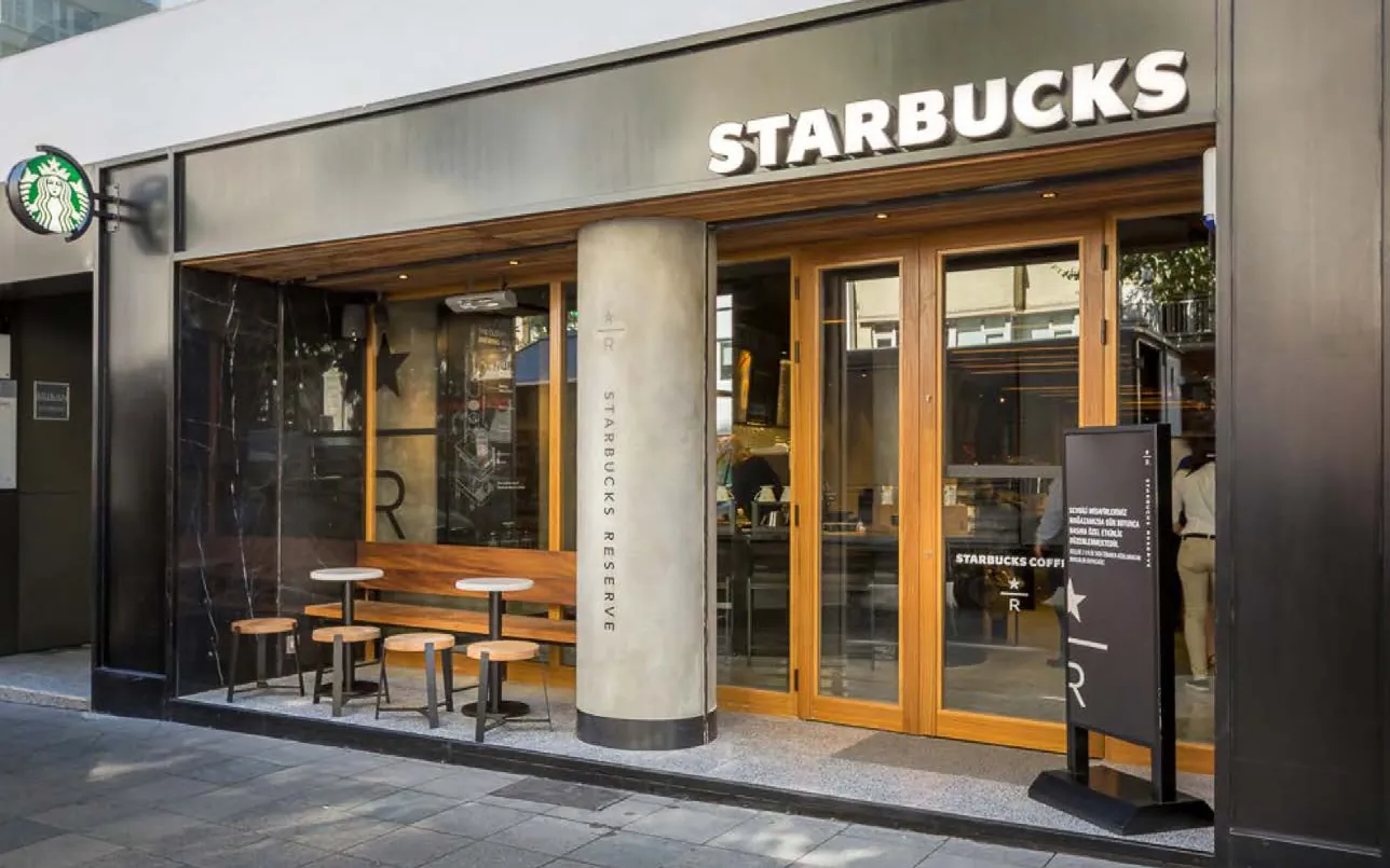 Storefront with timber doors between concrete columns
